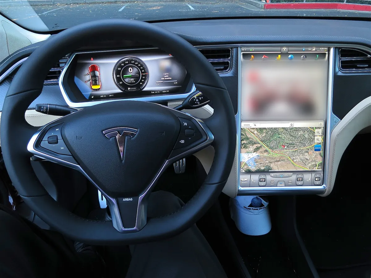 The dashboard of a Tesla Model S, showing its large centre touchscreen